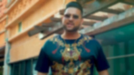 Karan Aujla in Multi Tees Outfit - Celebrity Clothing | Charmboard