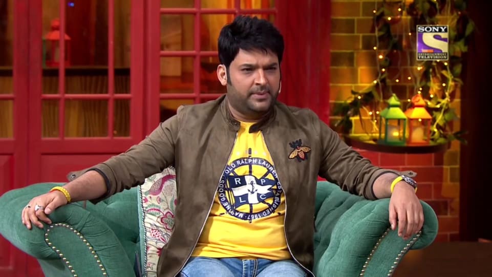 Kapil Sharma In Olive Jacket Outfit Celebrity Clothing Charmboard The kapil sharma show recently hosted actress sanjana sanghi and singer guru randhawa for a during the interaction, kapil recalled guru's brush with the cops at a hotel recently where he was.