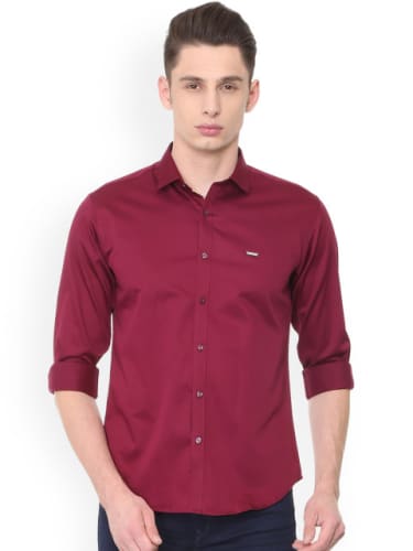 maroon shirt and blue jeans